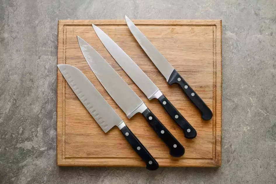 Best Japanese and Western Knife Set for $300 on a wooden cutting board